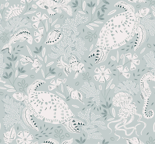 Ocean inspired wallpaper of a white swimming turtle, shells and fish with leaves and flowers. Blue background.