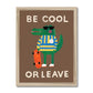 Art print in a natural wood frame. Our be cool or leave art print show a crocodile in a yellow and blue striped jumper and sunglasses, standing on his hind legs holding a skateboard, with the words be cool or leave in an off-white on a brown background.