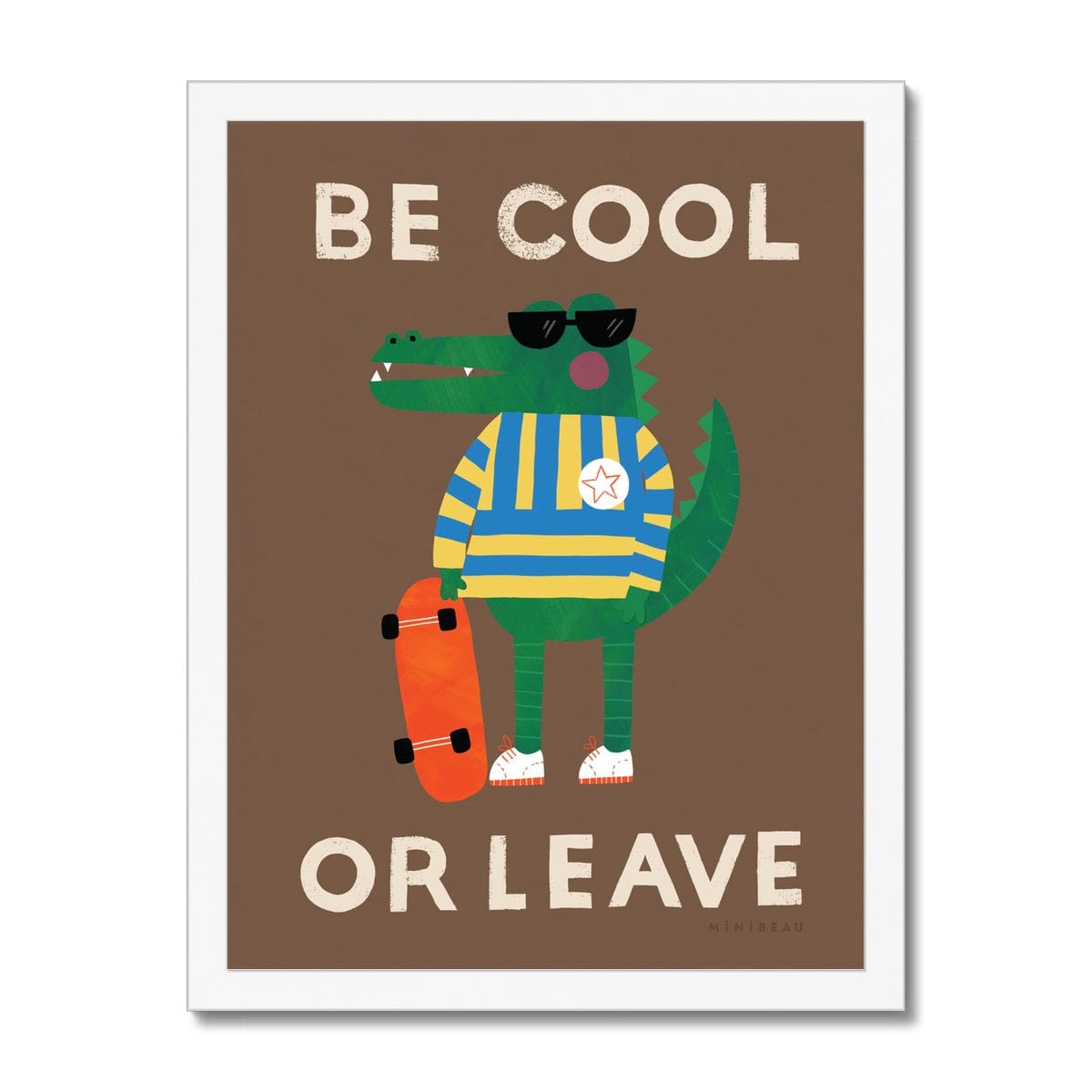 Art print in a white frame. Our be cool or leave art print show a crocodile in a yellow and blue striped jumper and sunglasses, standing on his hind legs holding a skateboard, with the words be cool or leave in an off-white on a brown background.