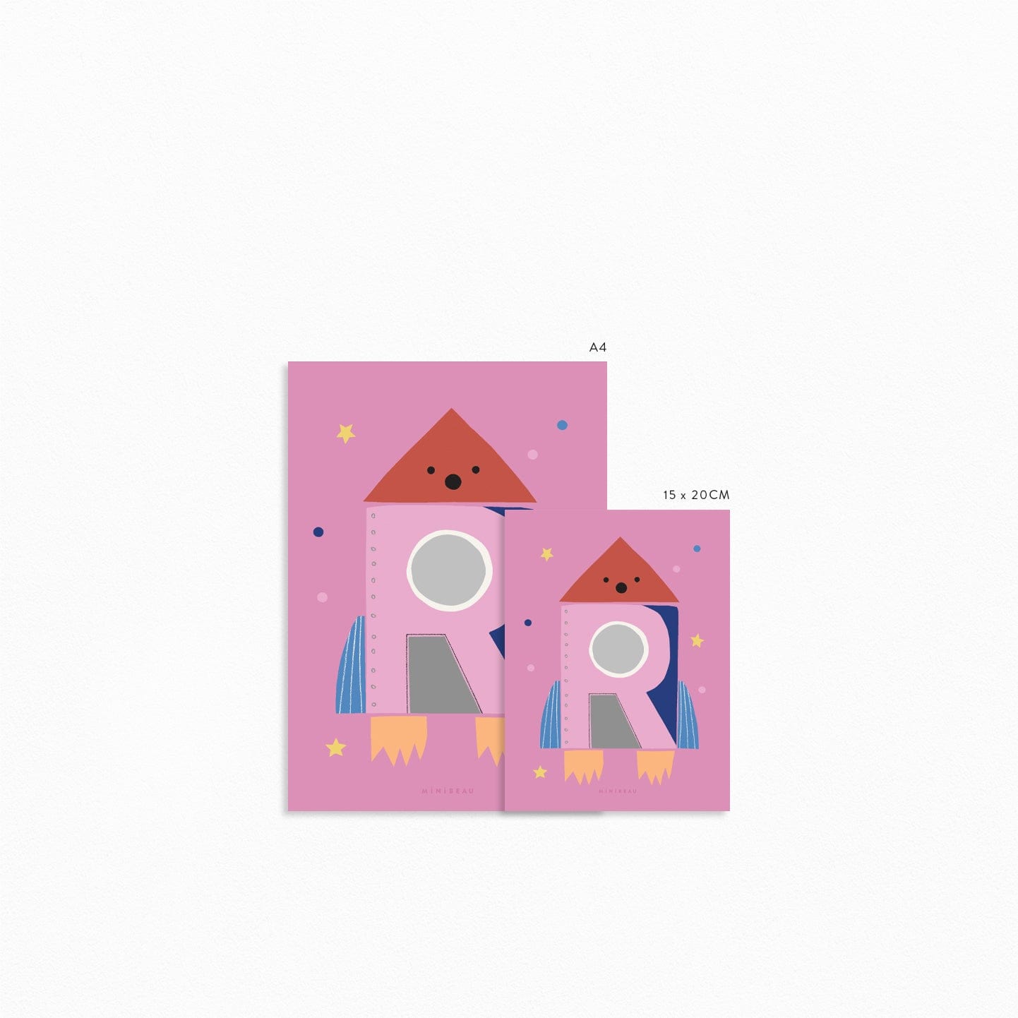 Art print showing both sizes, 15x20 and a4 next to each other. Our Happy Alphabet 'R' Art Print shows a shocked rocket lasting of to space with a large pink R on it creating a porthole. On a pink background with coloured dots and yellow stars.