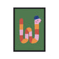 Art print in a black frame. Our Happy Alphabet 'W' Art Print shows a pink, red and orange wriggly worm in the shape of a W. The worm is wearing a blue baseball cap and is on a green background.