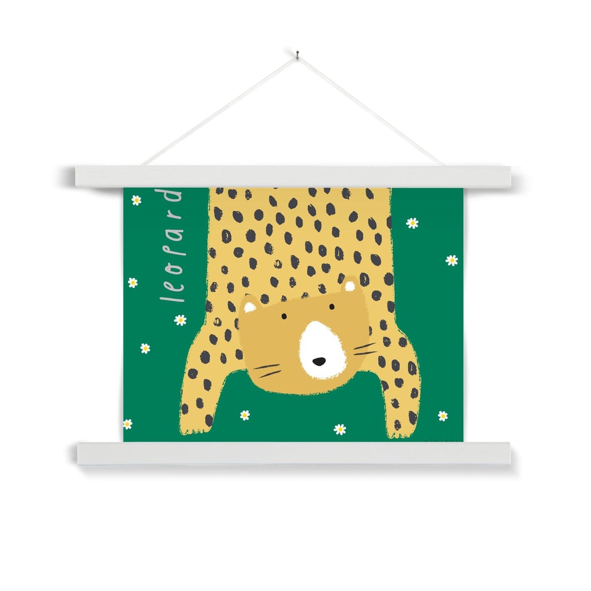 Our Leopard art print shows a hand-drawn leopard hanging down in to the picture, lifting it's head to look out at us on a green background with falling daisies, with the word leopard written alongside it, in a white wooden hanger, hanging from a nail in a white wall