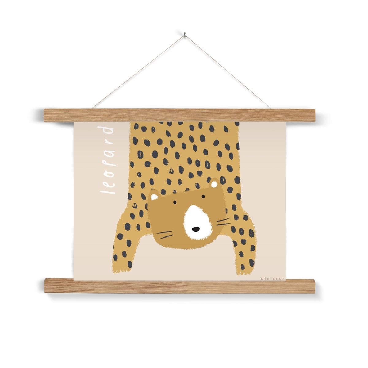 Our Leopard art print shows a hand-drawn leopard hanging down in to the picture, lifting it's head to look out at us on a beige background, with the word leopard written alongside it, in a natural wooden hanger, hanging from a nail in a white wall
