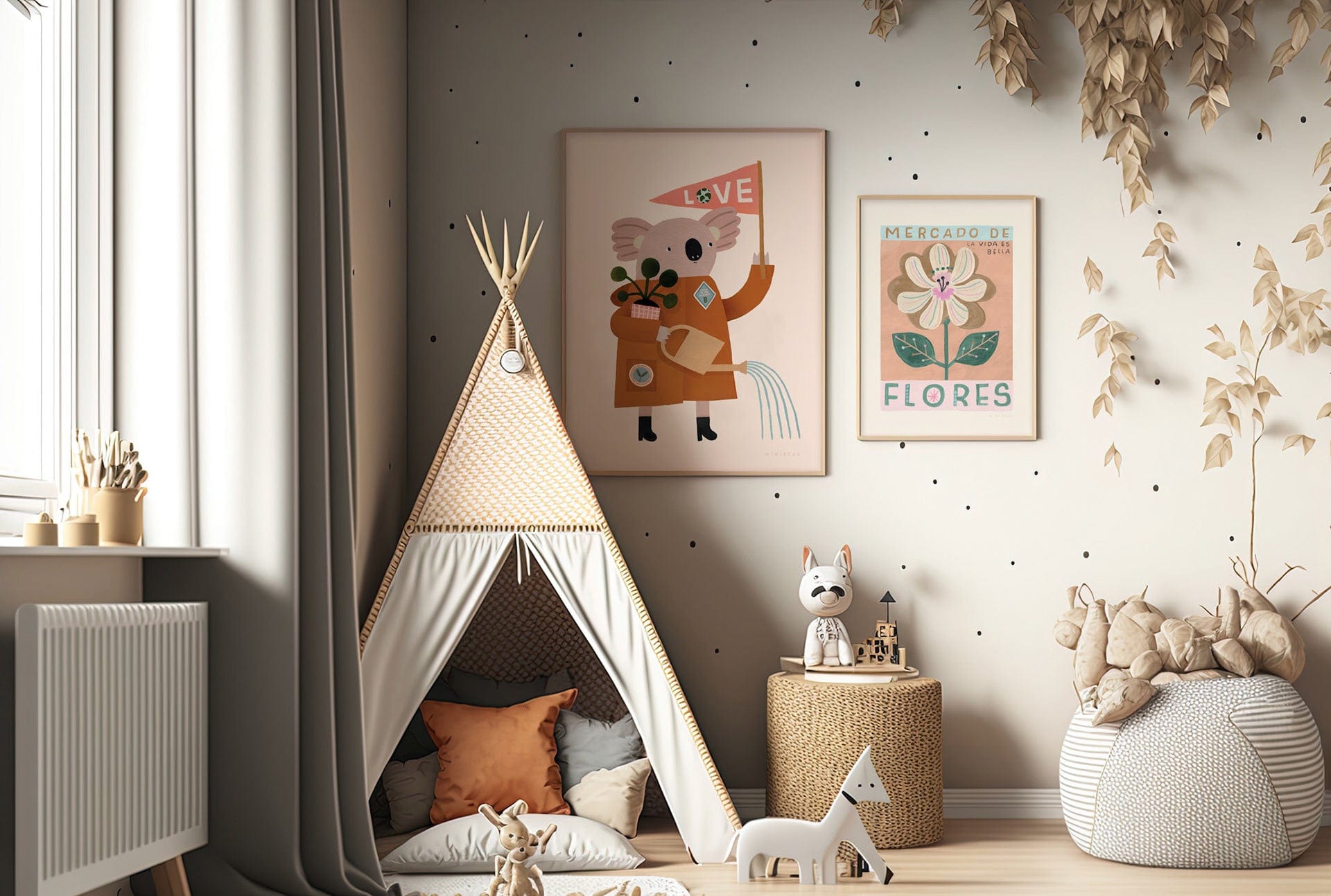The corner of a childs playroom with a neutral teepee, leopard print side table, and grey dotted and striped pouffe, the wall wallpapered in a neutral colour with black dots spaced out across the wall irregularly. Toys are in the foreground. On the wall art 2 art prints in light wood frames. The larger being our love our planet koala art print and the smaller being our mercado de flores art print. 