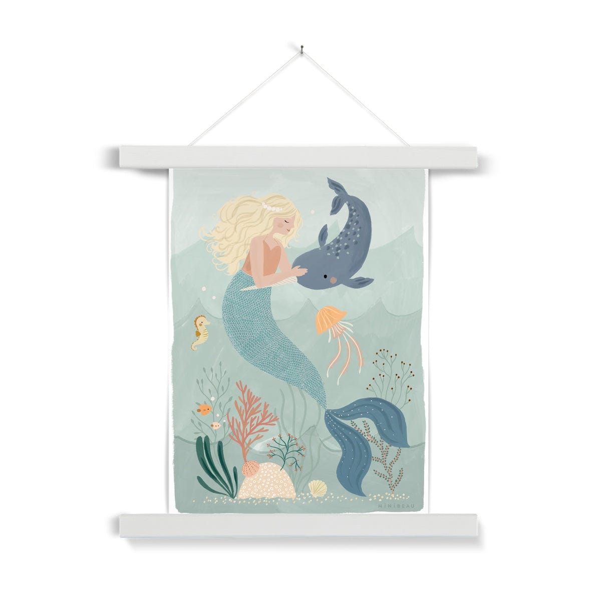Picture of a hand-painted picture depicting Coral the Mermaid petting a Narwhal at the bottom of the sea. Coral is blonde and wearing an orange top and her tail is a deep teal. She is wearing a pearl headband. In the background are 2 small angel fish, a sea horse and a jellyfish amongst sea foliage with a white border, in a white hanger, hanging from a nail