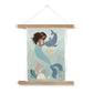Picture of a hand-painted picture depicting Pearl the Mermaid petting a Narwhal at the bottom of the sea. Coral has dark hair and wears an orange top and her tail is a deep teal. She is wearing a pearl headband. In the background are 2 small angel fish, a sea horse and a jellyfish amongst sea foliage with a white border in a natural wood hanger hanging from a nail