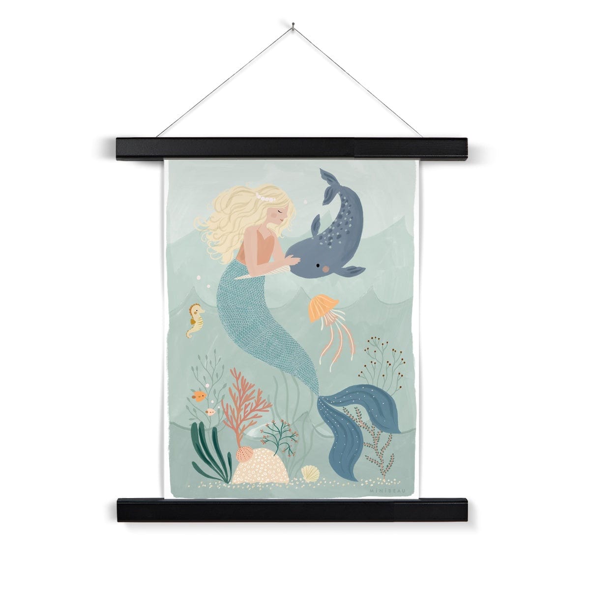 Picture of a hand-painted picture depicting Coral the Mermaid petting a Narwhal at the bottom of the sea. Coral is blonde and wearing an orange top and her tail is a deep teal. She is wearing a pearl headband. In the background are 2 small angel fish, a sea horse and a jellyfish amongst sea foliage with a white border, in a black wooden hanger, hanging from a nail
