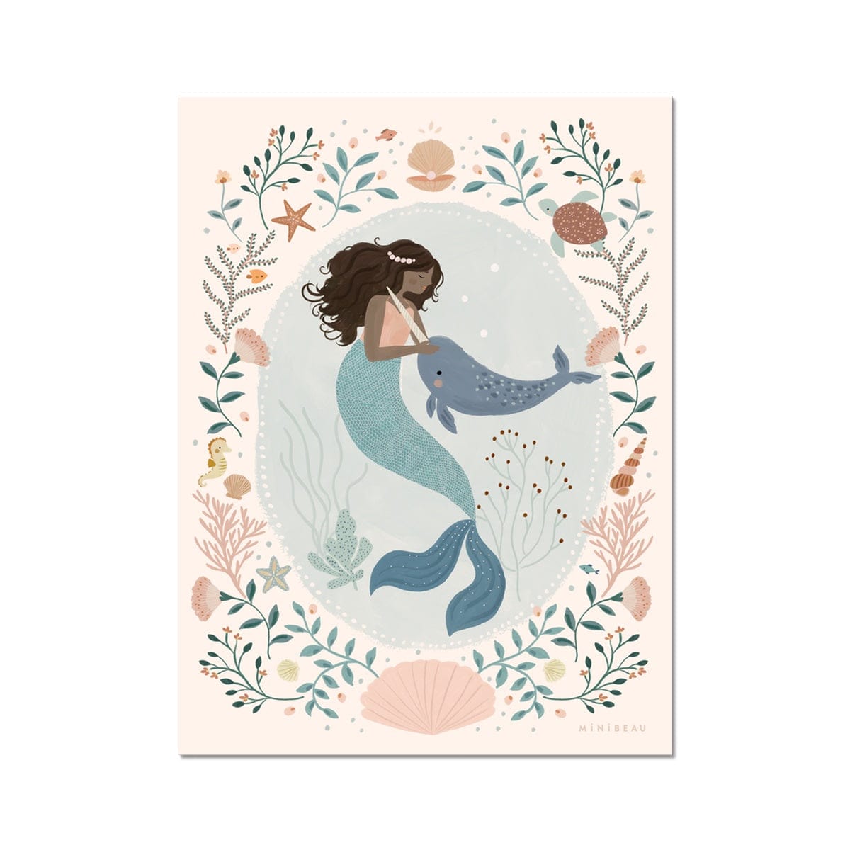 Beautiful dark skinned and haired mermaid with a pearl headband petting her friend Narwhal within a pale teal coloured oval background with white dots round the edge. On the outside of the oval is a sea themed border on a neutral background. The border consists of foliage, flowers and items you would find at the bottom of the sea, shells, turtle, sea horse with a large clam shell at the bottom.