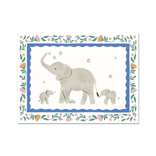 Our Pretty Serengeti kids art print featuring a family of hand-painted elephants, an adult and 2 cubs, one holding the adults tail. The adult elephant is spraying a few pink and blue flowers up in the air with their trunk. Surrounded by a blue scalloped border and a floral decorative frame featuring pink and orange flowers on a white background 