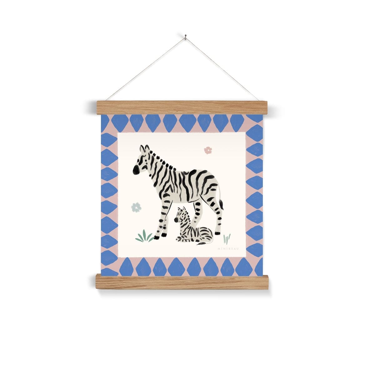 Hand-painted square picture of an adult and baby zebra, with the baby laying slightly under the standing adult  both looking out into the same direction. 2 simple small flowers. are in the background, one pink, one blue, with 2 tufts of grass one at the front and one at the back of the giraffe. Around the zebras is a wide dusty pink border with blue diamonds hanging from a nail in a natural wooden hanger