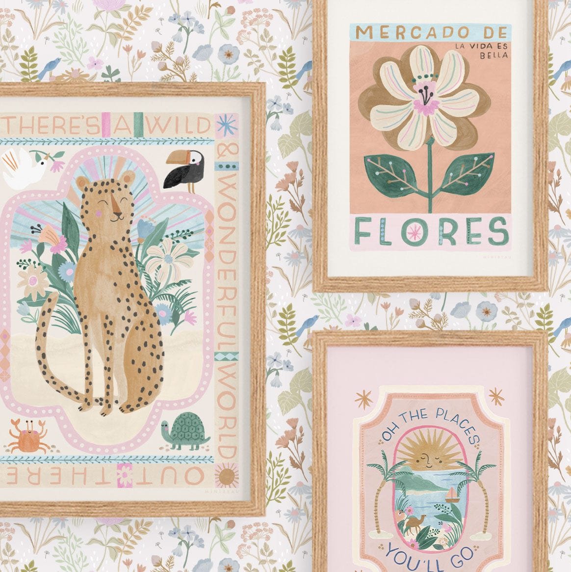 Showing a gallery wall of our wild, wonderful world, mercado de flores, and oh, the places you'll go prints in natural wood frames on a wall with our dreamy floral wallpaper