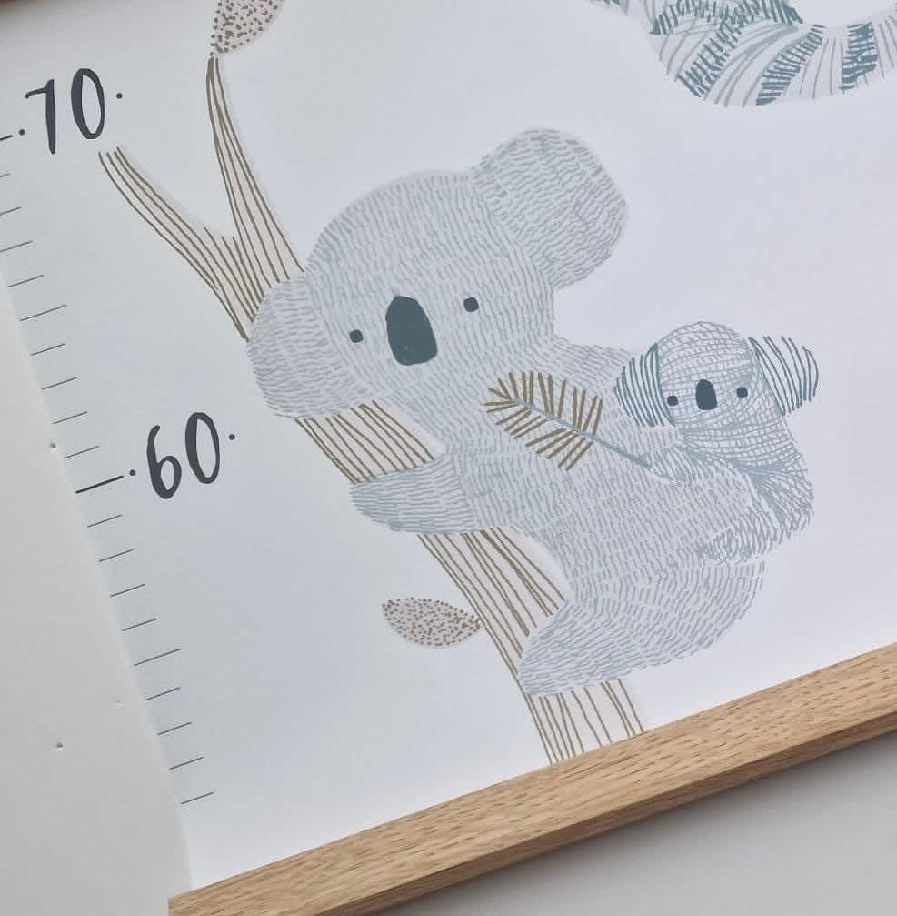 Close up of the bottom of the stripey safari height chart showing detail and the oak hanger