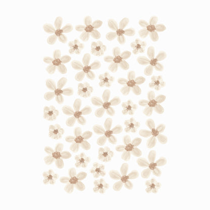 A sheet of our Murs Clairs Elle Flower stickers. Each sticker has a brown irregular centre with black specks. The petals are cream of varying tones with watercolour style details